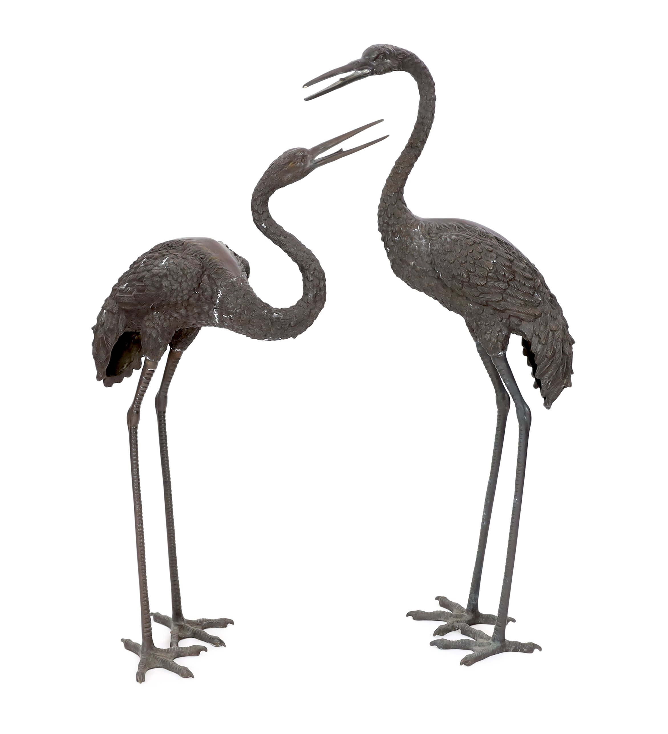A pair of 20th century Chinese bronze garden models of cranes, 140cm and 157cm high